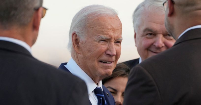 President Joe Biden talks to greeters after stepping off Air Force One upon arrival at Harry Reid International Airport in Las Vegas, Nevada, on July 15.