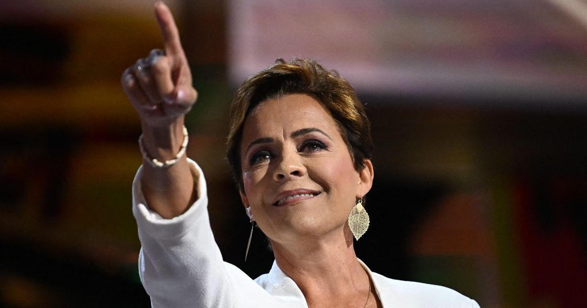 Kari Lake gestures as she arrives on stage to speak during the second day of the 2024 Republican National Convention in Milwaukee, Wisconsin, on Tuesday.