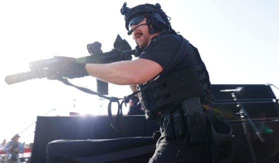 A law enforcement officer reacts after shots were fired at a rally for former President Donald Trump in Butler, Pennsylvania, on July 13.