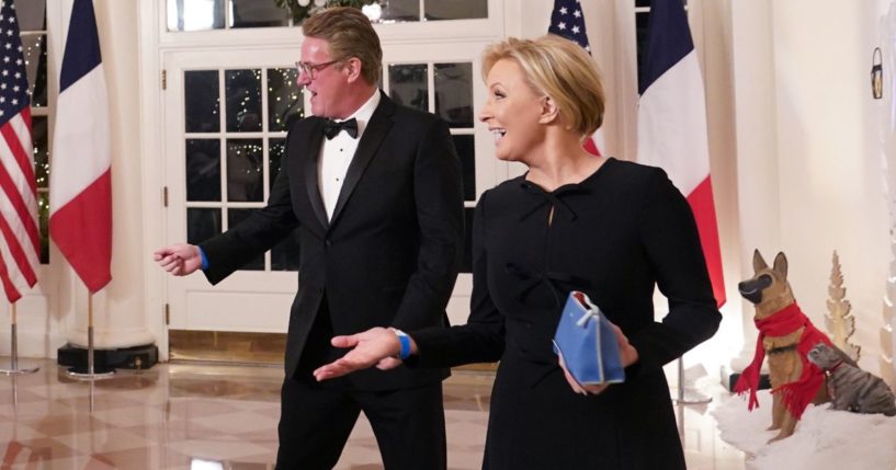 MSNBC television hosts Joe Scarborough, left, and Mika Brzezinski, right, arrive for the White House state dinner for French President Emmanuel Macron at the White House in Washington, D.C., on Dec. 1, 2022.