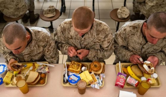 Members of the U.S. Marine Corps are seen eating on March 26, 2022, at the Marine base on Parris Island, South Carolina.