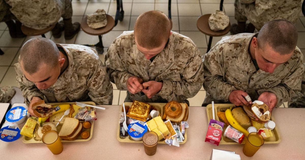 Members of the U.S. Marine Corps are seen eating on March 26, 2022, at the Marine base on Parris Island, South Carolina.
