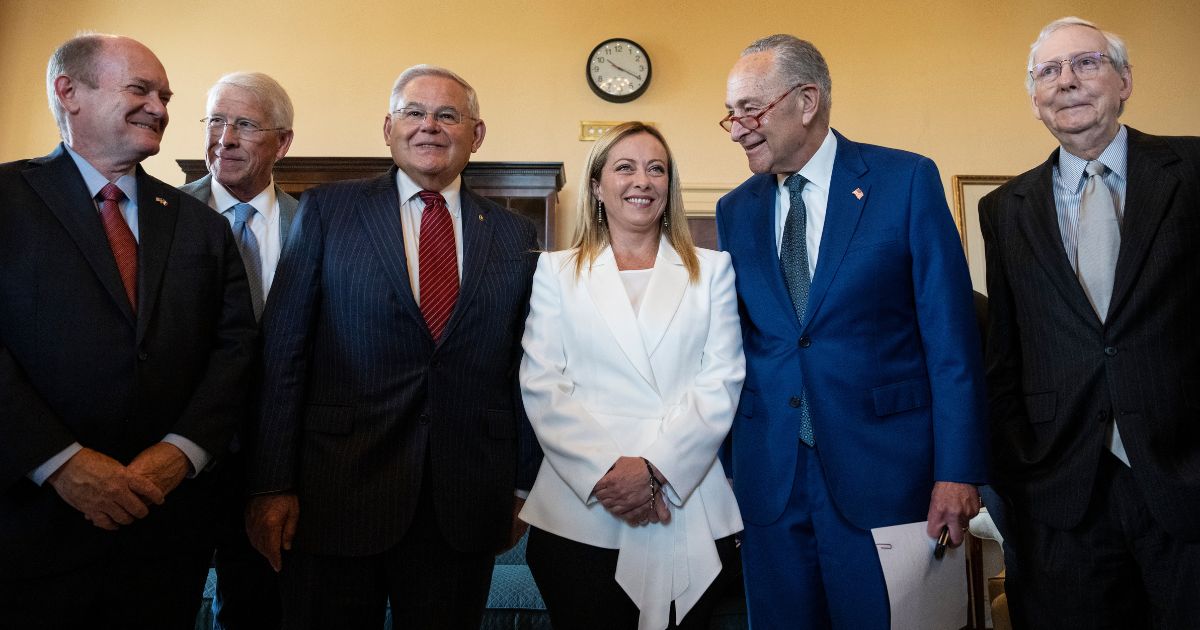 Italian Prime Minister Giorgia Meloni, center, stands with, from left, Sens. Chris Coons, Roger Wicker, Robert Menendez, Chuck Schumer and Mitch McConnell before a meeting at the U.S. Capitol in Washington on July 27, 2023.
