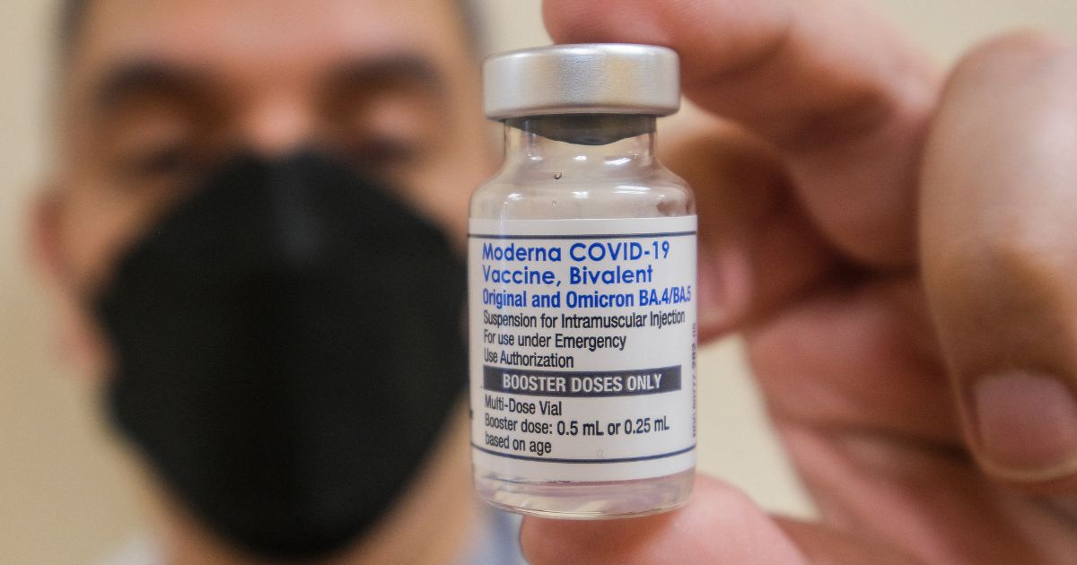 A pharmacist holds up a vial of the Moderna Covid-19 vaccine in Los Angeles, California, on Oct. 6, 2022.