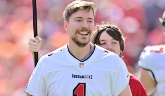 YouTube personality MrBeast runs on to the field prior to a game between the Tampa Bay Buccaneers and the Atlanta Falcons in Tampa, Florida, on Oct. 22, 2023.