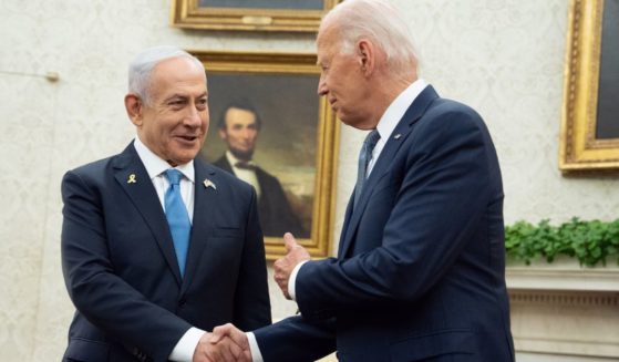 Israeli Prime Minister Benjamin Natanyahu, left, shakes the hand of President Joe Biden, right, during a meeting at the White House in Washington, D.C., on Thursday.