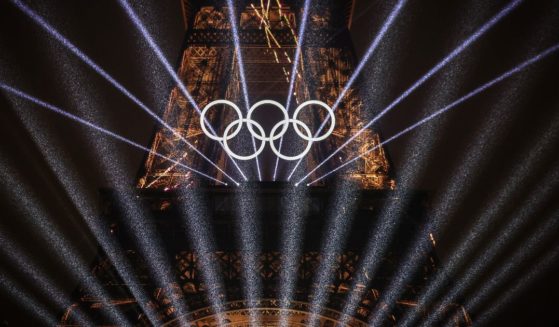 A light show takes place as The Olympic Rings on the Eiffel Tower are illuminated during the opening ceremony of the Olympic Games Paris 2024 in Paris, France, on Friday.