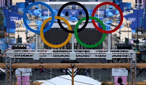 The Olympic rings are seen during preparation works at the Eiffel Tower stadium in Paris, France, on Wednesday.