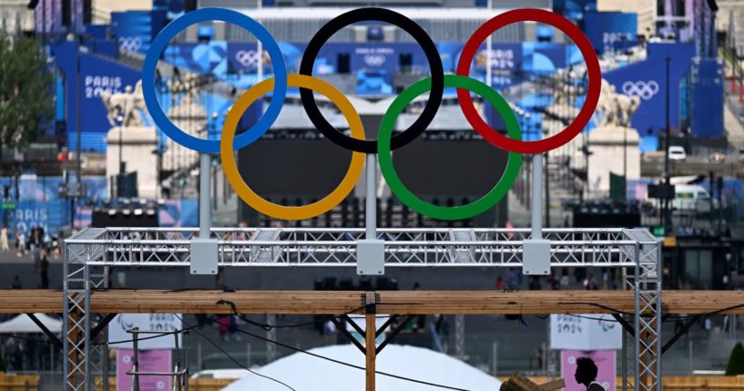 The Olympic rings are seen during preparation works at the Eiffel Tower stadium in Paris, France, on Wednesday.