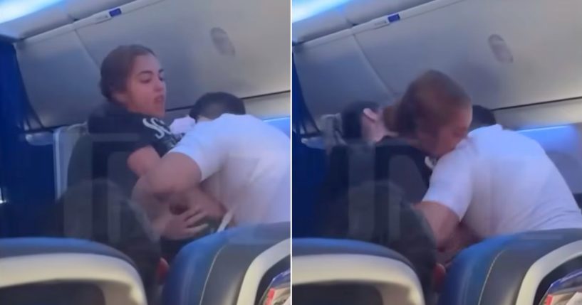 A passenger bites a flight attendant who is restraining her.