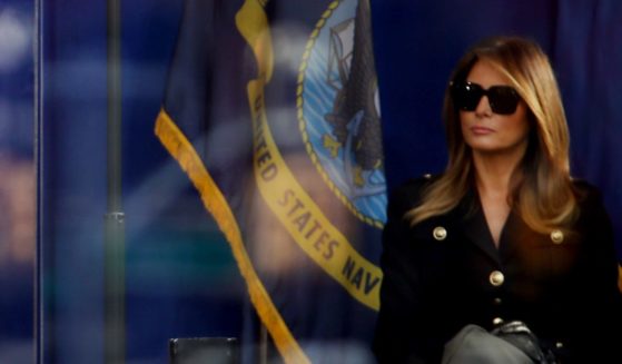President Donald Trump speaks at the opening ceremony of the Veterans Day Parade as first lady Melania Trump listens on November 11, 2019 in New York City.