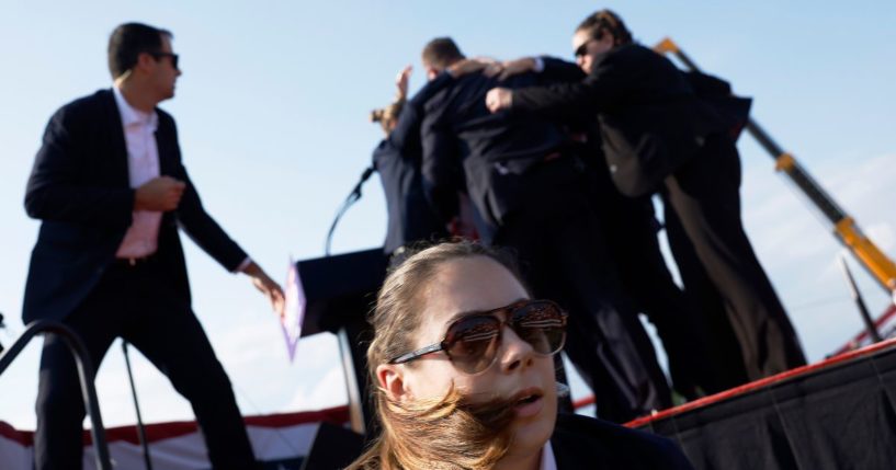 Republican presidential candidate former President Donald Trump is rushed offstage by U.S. Secret Service agents after being grazed by a bullet during a rally.