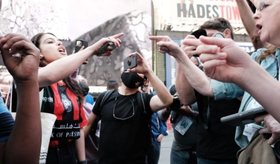 Pro Palestinian protesters face off with a group of Israel supporters and police in a violent clash in Times Square on May 20, 2021 in New York City.