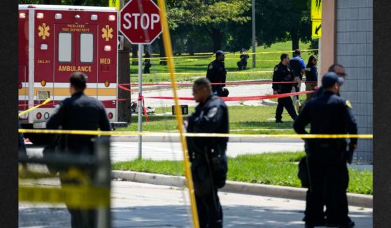 Police investigate a shooting Tuesday near King Park during the second day of the 2024 Republican National Convention in Milwaukee, Wisconsin. The shooting occurred outside of the security perimeter for the event.