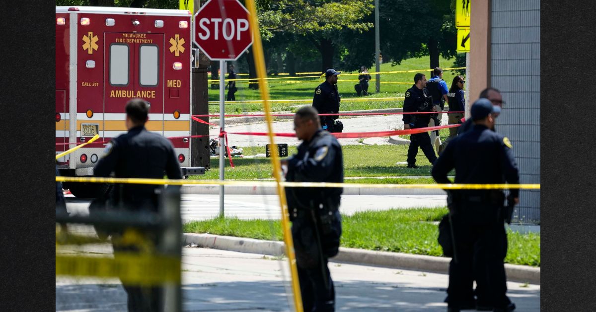 Police investigate a shooting Tuesday near King Park during the second day of the 2024 Republican National Convention in Milwaukee, Wisconsin. The shooting occurred outside of the security perimeter for the event.