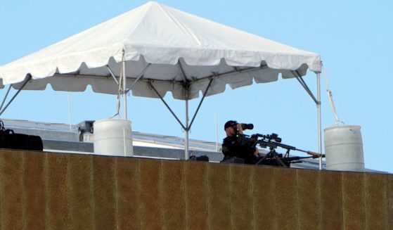 A Secret Service sniper sits in position on top of the Fiserv Forum during the third day of the 2024 Republican National Convention in Milwaukee, Wisconsin, on July 17.