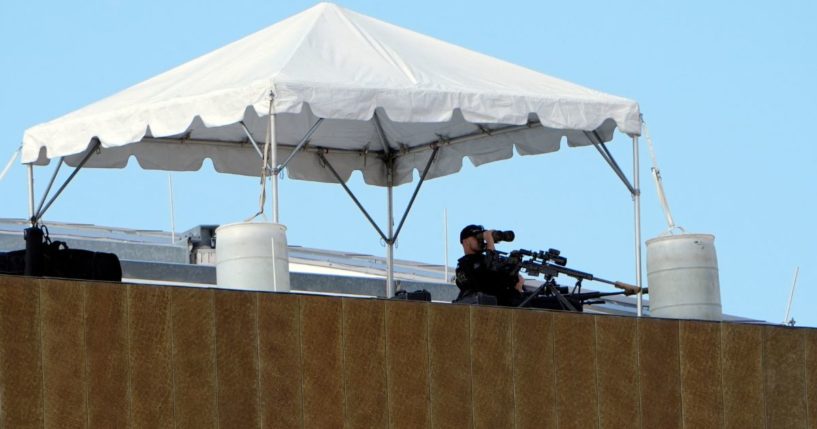 A Secret Service sniper sits in position on top of the Fiserv Forum during the third day of the 2024 Republican National Convention in Milwaukee, Wisconsin, on July 17.