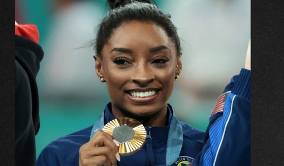 Simone Biles of Team USA celebrates on the podium during the medal ceremony for the Artistic Gymnastics Women's Team Final on day four of the Olympic Games Tuesday in Paris, France.