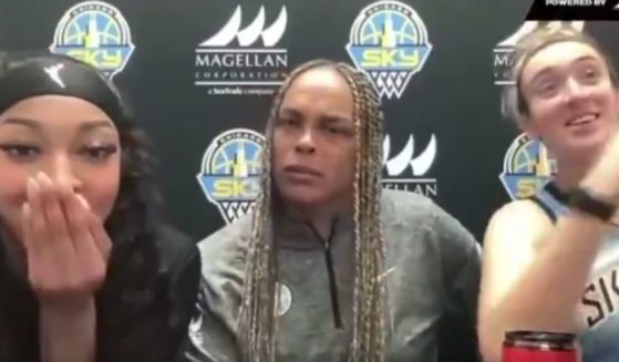 Chicago Sky players Angel Reese, left, and Marina Mabrey, right, and coach Teresa Weatherspoon react to a reporters hot mic moment during a Sunday interview.