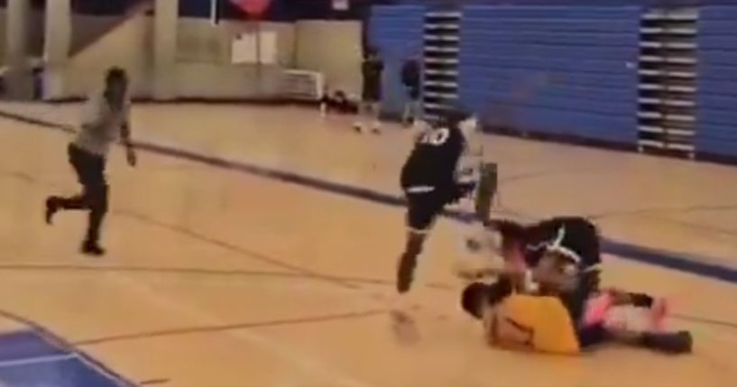 A referee rushed to intervene as the boy stomped hard on an opponent's head.