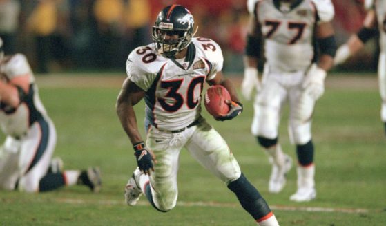 Terrell Davis of the Denver Broncos carries the ball against the Atlanta Falcons in Super Bowl XXXIII at Pro Player Stadium in Miami on Jan. 31, 1999.
