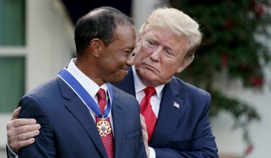 Then-President Donald Trump is seen awarding professional golfer and business partner Tiger Woods the Medal of Freedom during a ceremony at the White House May 6, 2019.