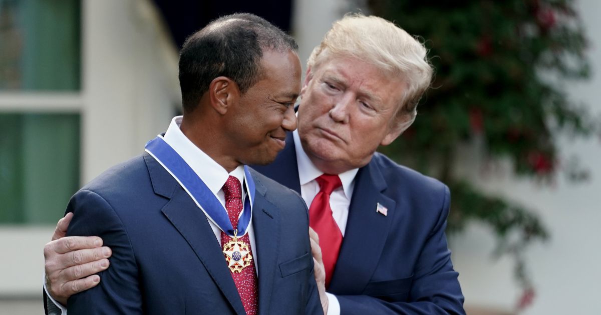 Then-President Donald Trump is seen awarding professional golfer and business partner Tiger Woods the Medal of Freedom during a ceremony at the White House May 6, 2019.
