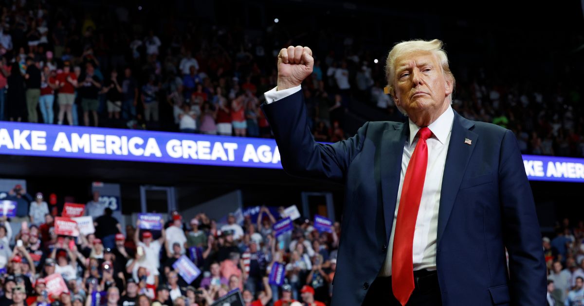 Republican presidential nominee and former President Donald Trump walks offstage after speaking at a campaign rally at the Van Andel Arena in Grand Rapids, Michigan, on Saturday.
