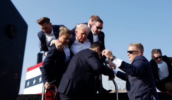 Republican presidential candidate and former President Donald Trump is rushed offstage after an assassination attempt during a rally in Butler, Pennsylvania, on Saturday.