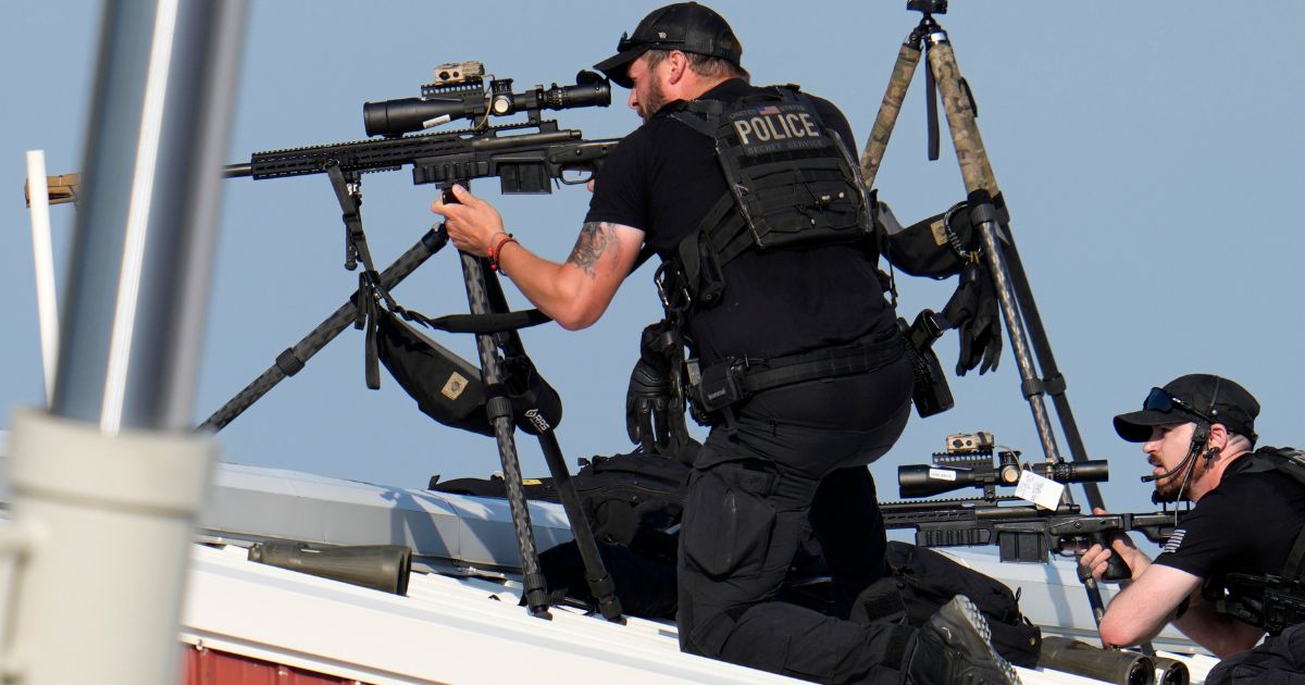 Police snipers return fire after shots were fired at former President Donald Trump at a campaign rally in Butler, Pennsylvania, on Saturday.