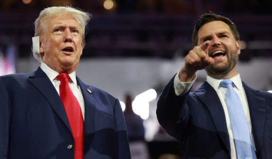 Former President Donald Trump, left, and Republican Vice Presidential candidate J.D. Vance, right, appear on the first day of the Republican National Convention in Milwaukee, Wisconsin, on Monday.