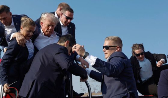 Republican presidential candidate and former President Donald Trump is rushed offstage by Secret Service agents after being shot during a rally in Butler, Pennsylvania, on Saturday.