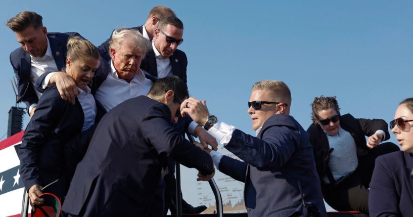 Republican presidential candidate and former President Donald Trump is rushed offstage by Secret Service agents after being shot during a rally in Butler, Pennsylvania, on Saturday.