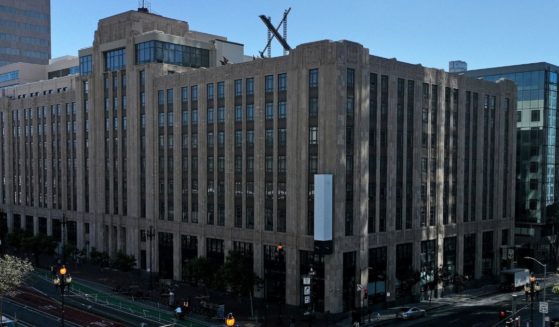 A large X logo is visible on the roof of X, formerly Twitter, headquarters in San Francisco, California, on July 31, 2023.