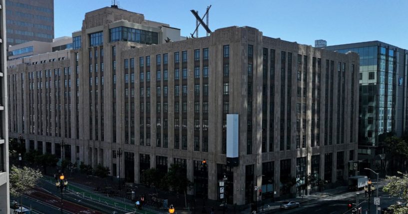 A large X logo is visible on the roof of X, formerly Twitter, headquarters in San Francisco, California, on July 31, 2023.