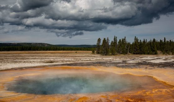 One of the many hot springs in close proximity to the iconic Grand Prismatic Spring in Yellowstone National Park's Midway Geyser Basin is pictured on Sept. 18, 2022.
