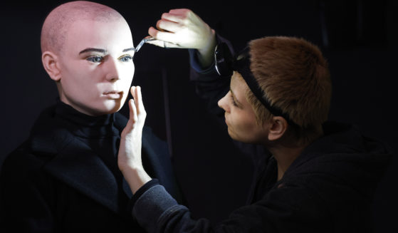 In this undated handout photo provided by The National Wax Museum Plus, Artistic Coordinator Mel Creek applies the finishing touches on a wax figure of the late singer Sinead O'Connor, at the National Wax Museum Plus in Dublin, Ireland.