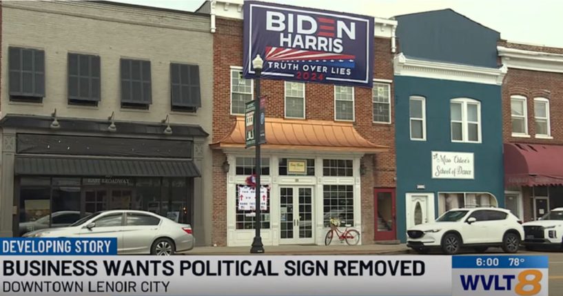 A sign supporting President Joe Bidena and Vice President Kamala Harris above a business in a Tennessee city.