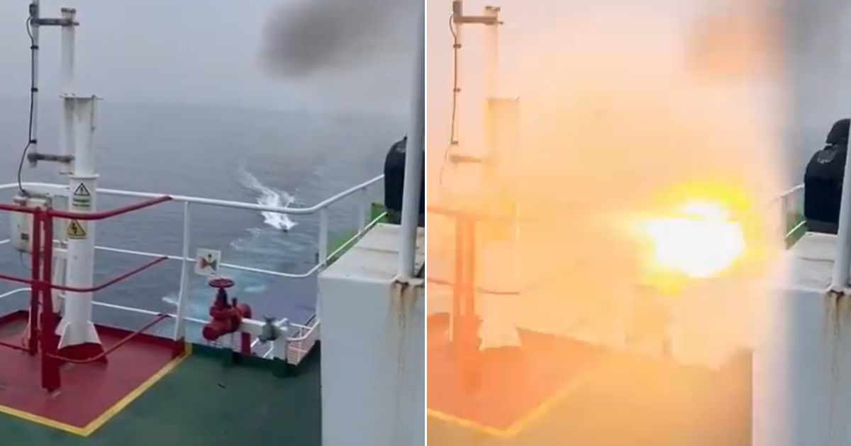 A boat approaches a cargo vessel and then explodes.
