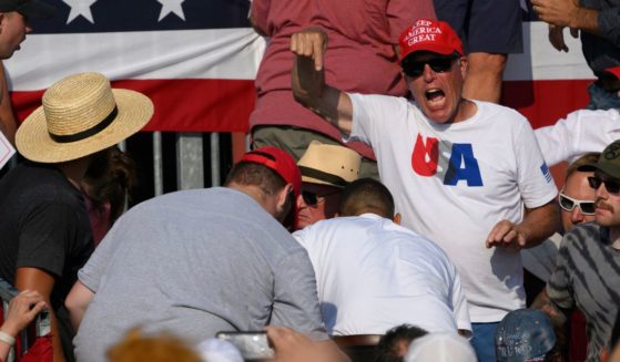 Attendees scatter after gunfire rang out during a campaign rally for Republican presidential candidate, former U.S. President Donald Trump at Butler Farm Show Inc. on July 13, 2024 in Butler, Pennsylvania.