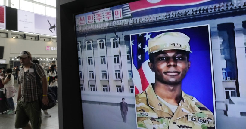 A TV screen shows a file image of American soldier Travis King during a news program at the Seoul Railway Station in Seoul, South Korea on Aug. 16, 2023.