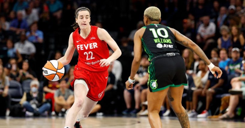 Caitlin Clark #22 of the Indiana Fever dribbles the ball against Courtney Williams #10 of the Minnesota Lynx in the first quarter at Target Center on July 14, 2024 in Minneapolis, Minnesota.