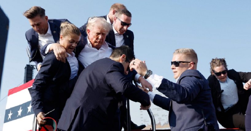 Former President Donald Trump is assisted offstage July 13 after a nearly successful assassination attempt in Butler, Pennsylvania. (Anna Moneymaker / Getty Images)