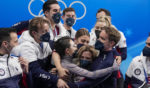 Madison Chock and Evan Bates of the United States react after the team ice dance program during the figure skating competition at the 2022 Winter Olympics in Beijing on Feb. 7, 2022.