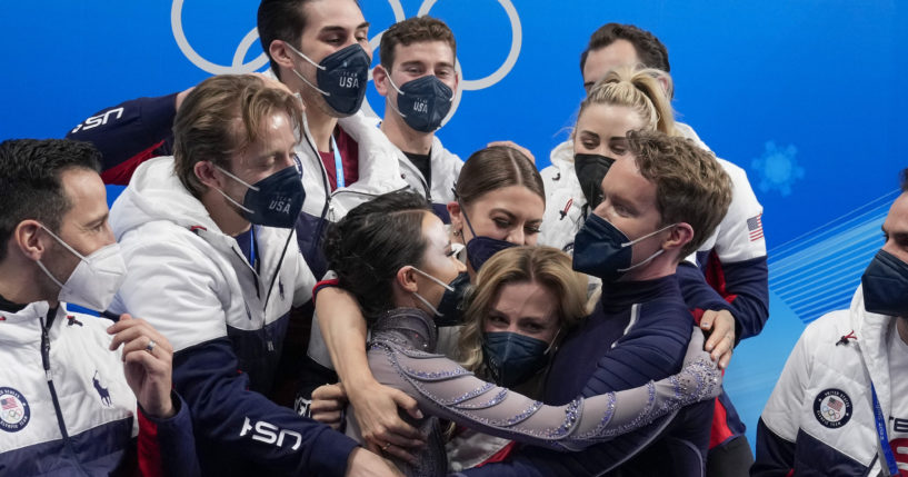 Madison Chock and Evan Bates of the United States react after the team ice dance program during the figure skating competition at the 2022 Winter Olympics in Beijing on Feb. 7, 2022.