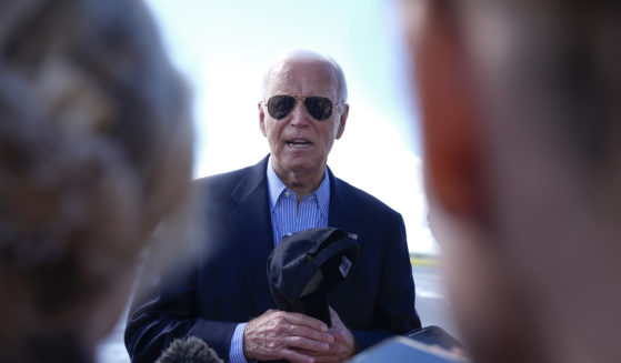 President Joe Biden speaks to reporters on the tarmac before departing at Dane County Regional Airport in Madison, Wisconsin, following a campaign visit on Friday.