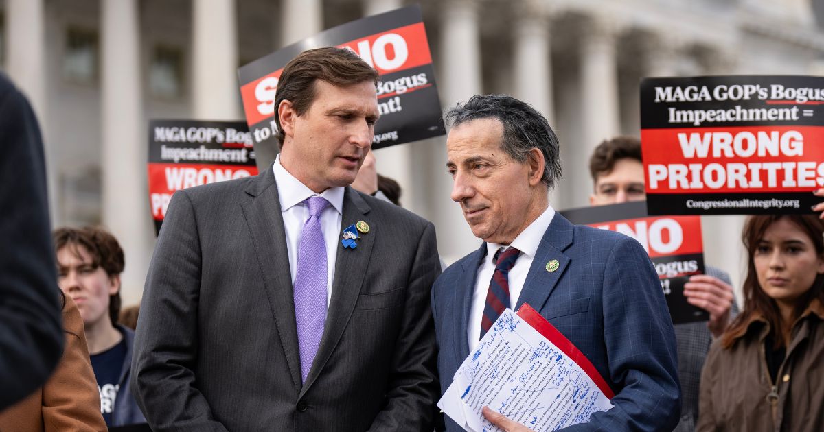 (L-R) Rep. Dan Goldman (D-NY) speaks with Rep. Jamie Raskin (D-MD) during a news conference about Republican efforts to open an impeachment inquiry into U.S. President Joe Biden, outside the U.S. Capitol on December 13, 2023 in Washington, DC.