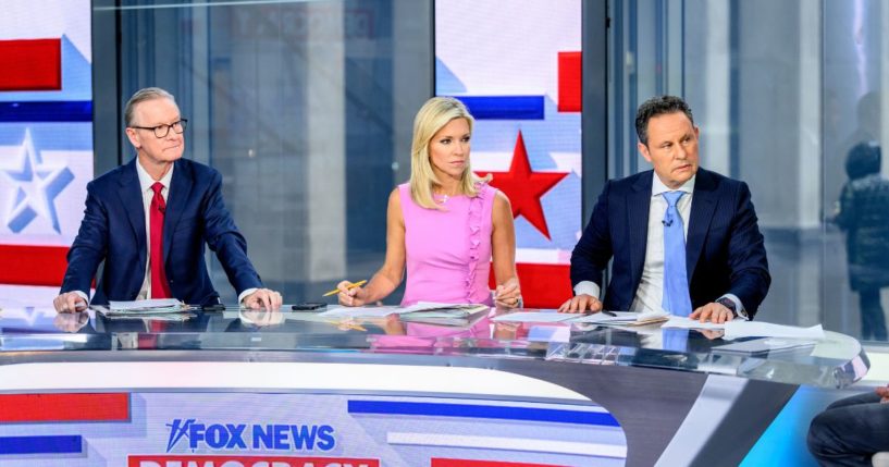 Hosts Steve Doocy, Ainsley Earhardt and Brian Kilmeade with presidential candidate Robert F. Kennedy Jr. (not pictured) as he visits "Fox & Friends" at Fox News Channel Studios on April 2, 2024 in New York City.