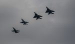 Four fighter jets from the U.S. Air Force and Royal Canadian Air Force fly in formation during training in May 2021.