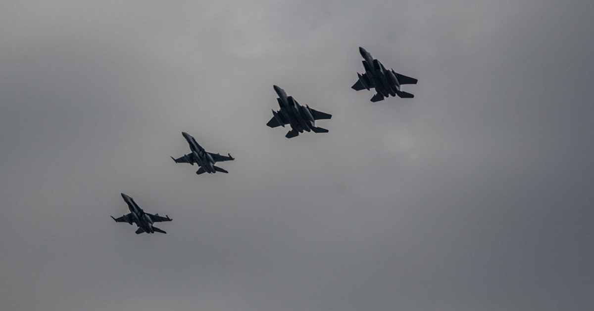 Four fighter jets from the U.S. Air Force and Royal Canadian Air Force fly in formation during training in May 2021.